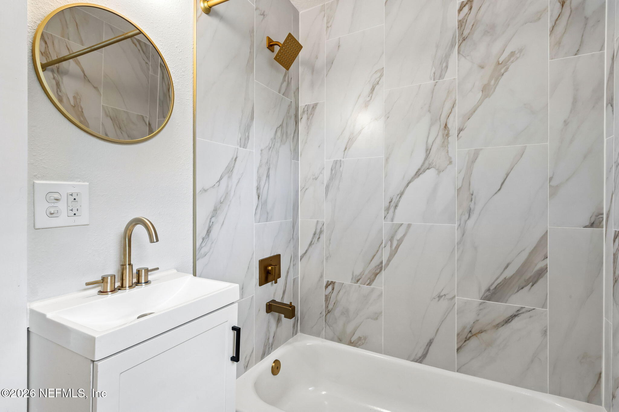 3668 Marianna Road Jacksonville, FL 32217 - Photo 21 of 28 a bathroom with a sink and a mirror