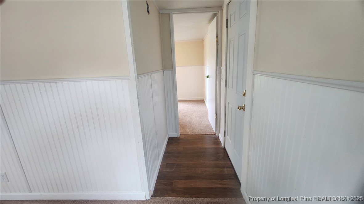 640 Faith Road Pembroke, NC 28372 - Photo 14 of 18 a view of a hallway with wooden floor