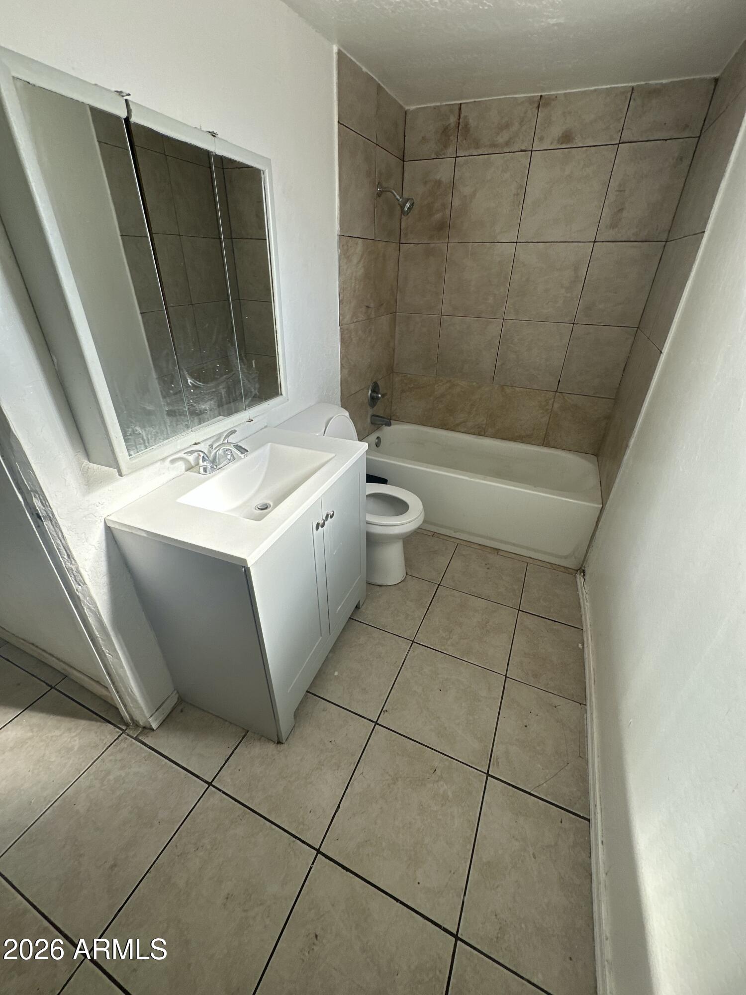 2501 East Jones Avenue Phoenix, AZ 85040 - Photo 19 of 33 a bathroom with a sink toilet and shower
