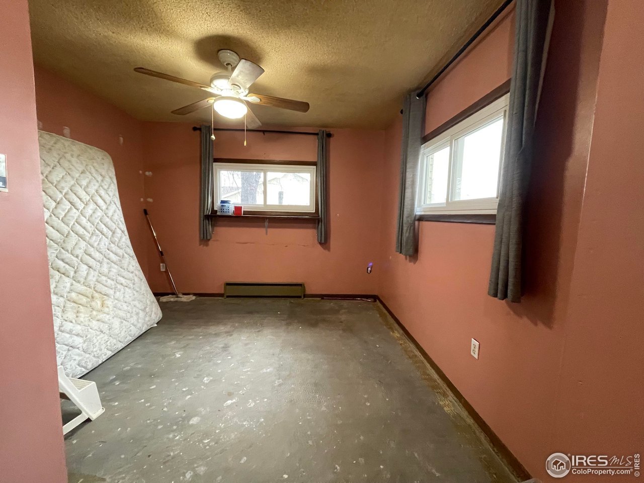 220 New York Avenue Stratton, CO 80836 - Photo 11 of 23 a view of an empty room with a window