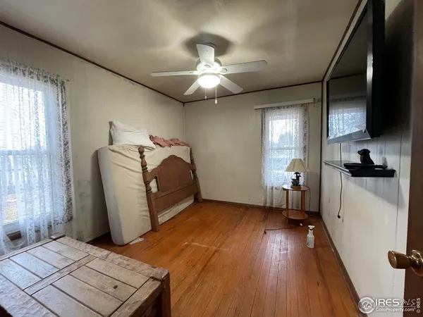 a view of a livingroom with furniture and a window