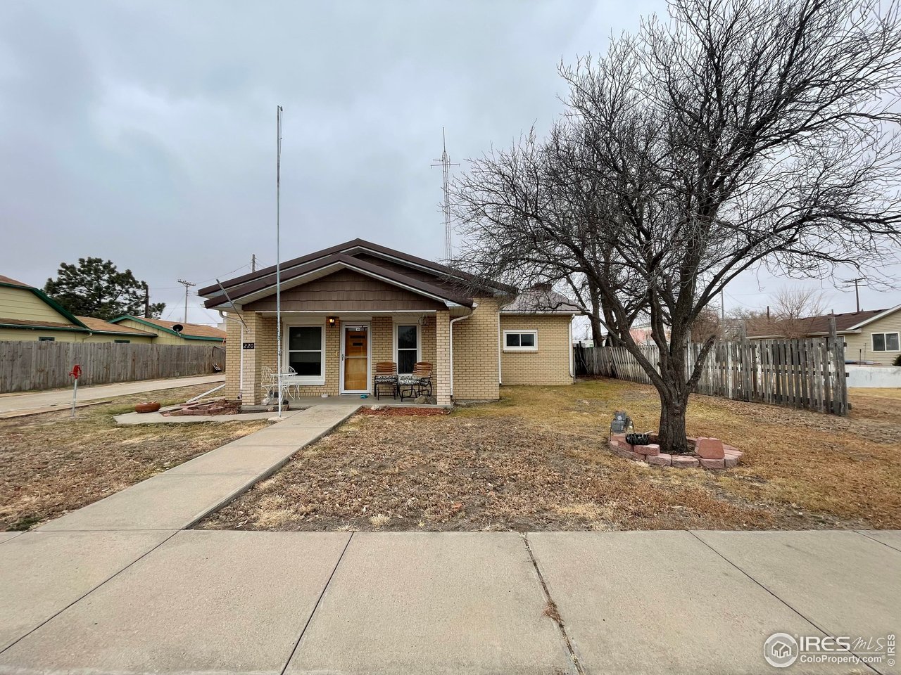 220 New York Avenue Stratton, CO 80836 - Photo 22 of 23 a front view of a house with a yard