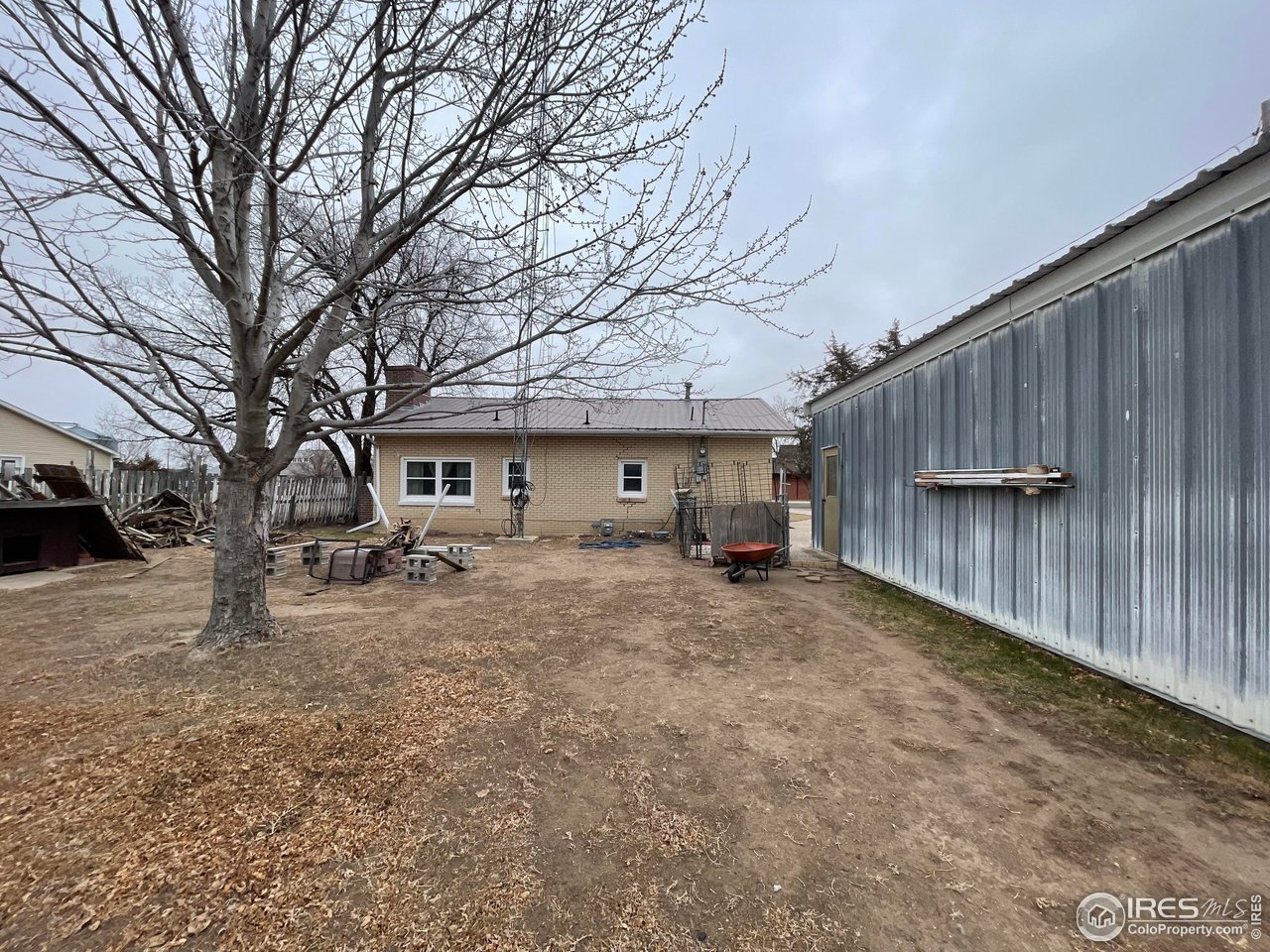220 New York Avenue Stratton, CO 80836 - Photo 23 of 23 a view of a house with a yard covered in snow