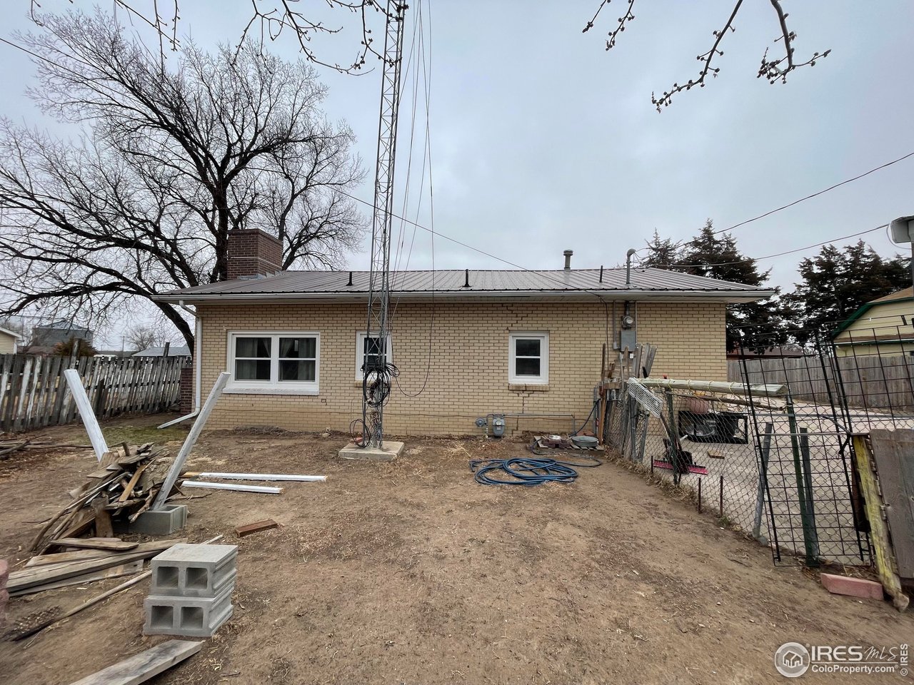 220 New York Avenue Stratton, CO 80836 - Photo 3 of 23 a view of a backyard with furniture and a area