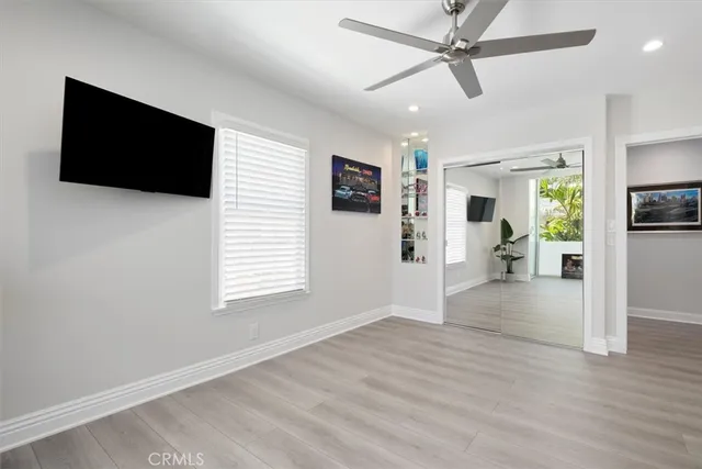 a bathroom with a granite countertop sink mirror and shower