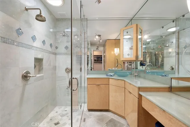 a bed room with a bed and a chandelier