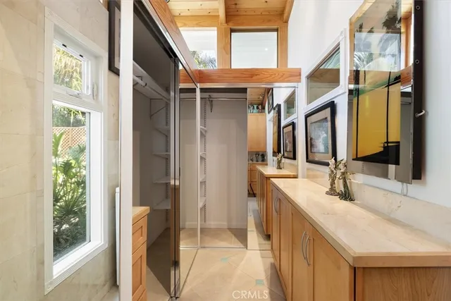 a spacious bathroom with a bathtub sink and mirror