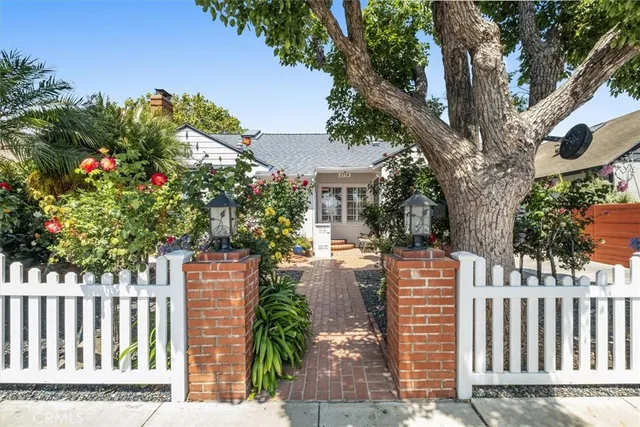 a view of a kitchen with a sink and a stove top oven