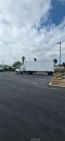 a big yard with road and barbeque oven