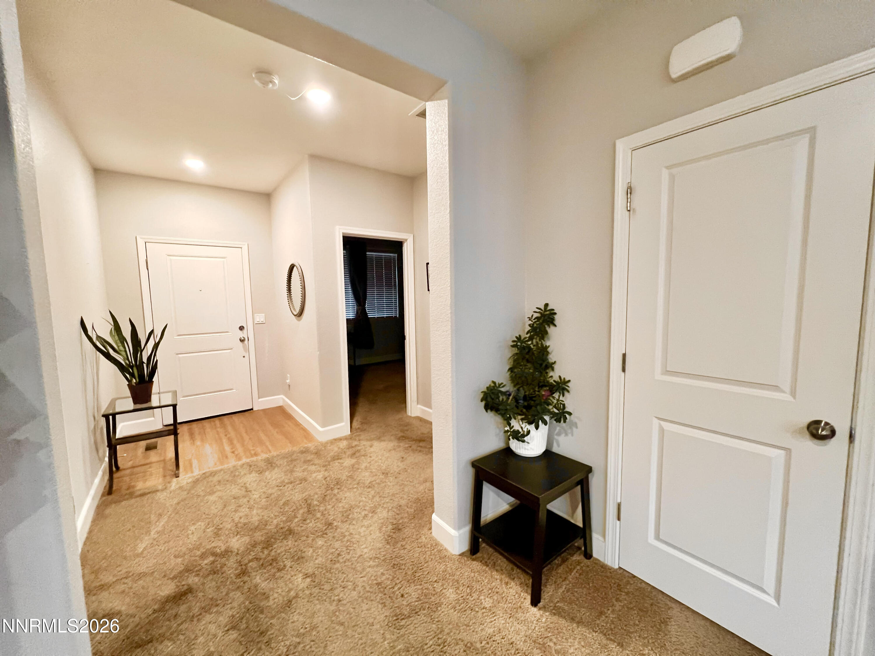 9355 Bay Drive Reno, NV 89506 - Photo 17 of 42 a living room with furniture and a potted plant