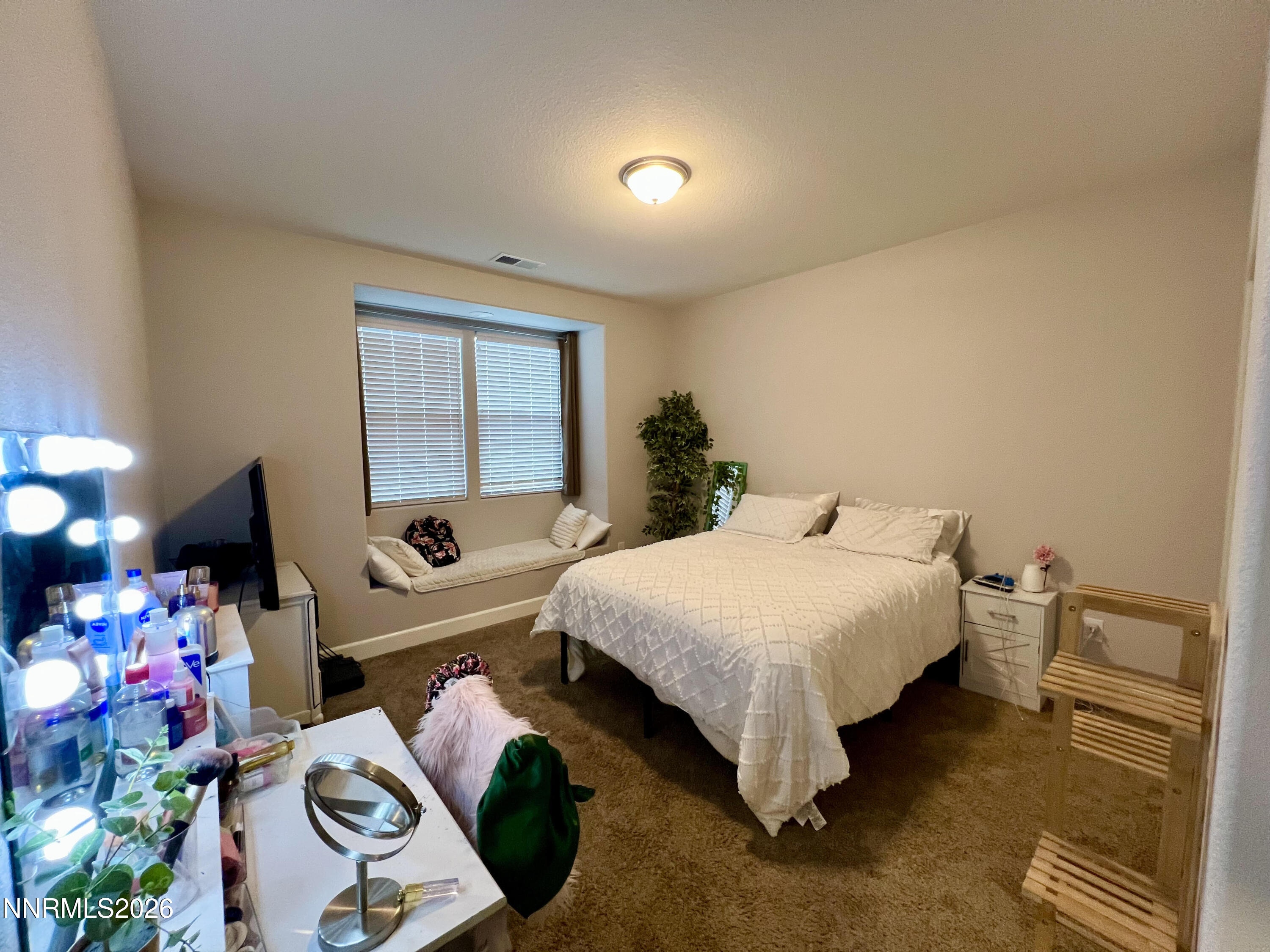 9355 Bay Drive Reno, NV 89506 - Photo 29 of 42 a bedroom with a bed and a window