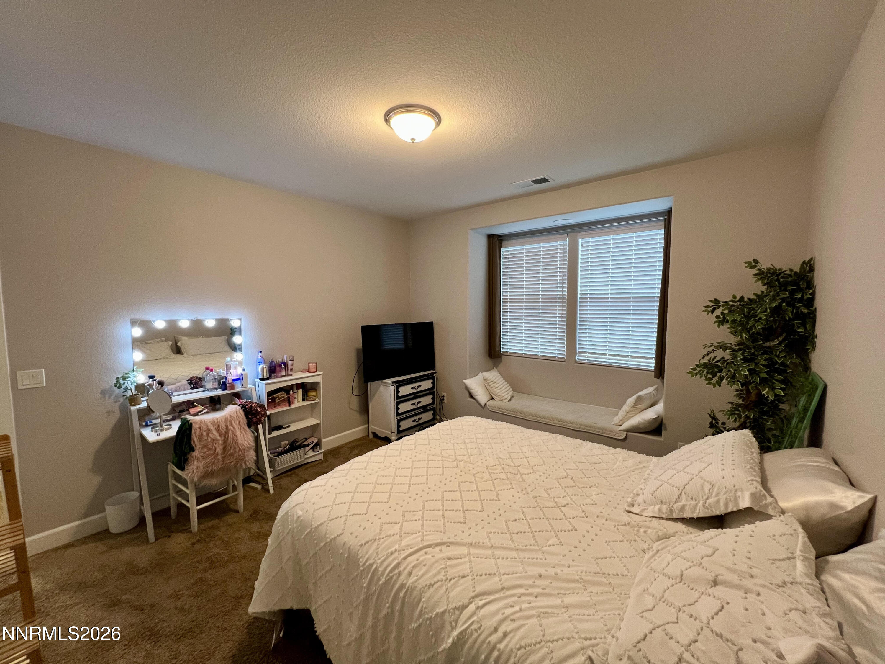 9355 Bay Drive Reno, NV 89506 - Photo 30 of 42 a bedroom with a bed and a large window