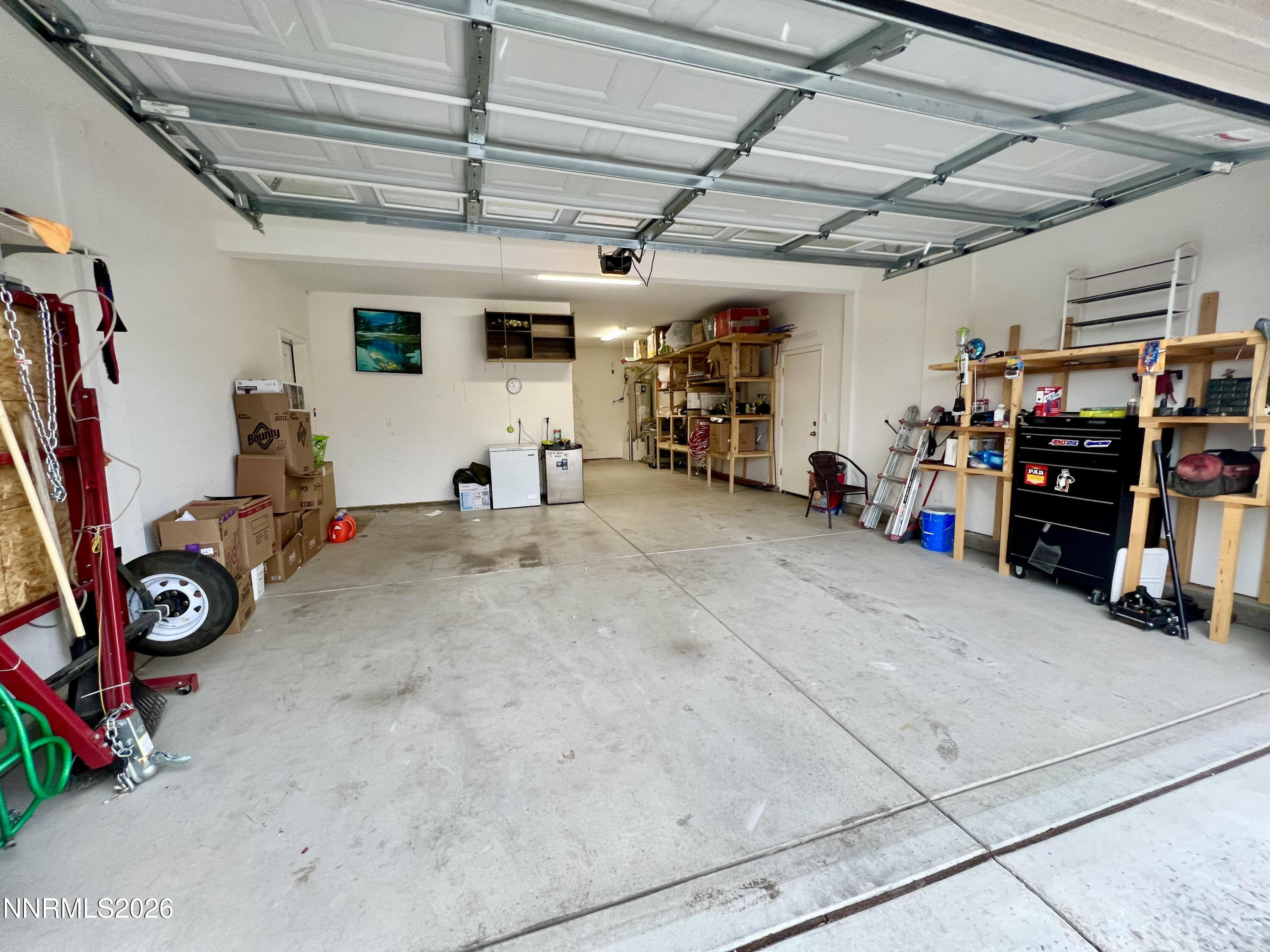 9355 Bay Drive Reno, NV 89506 - Photo 39 of 42 a view of a garage with a bike and car