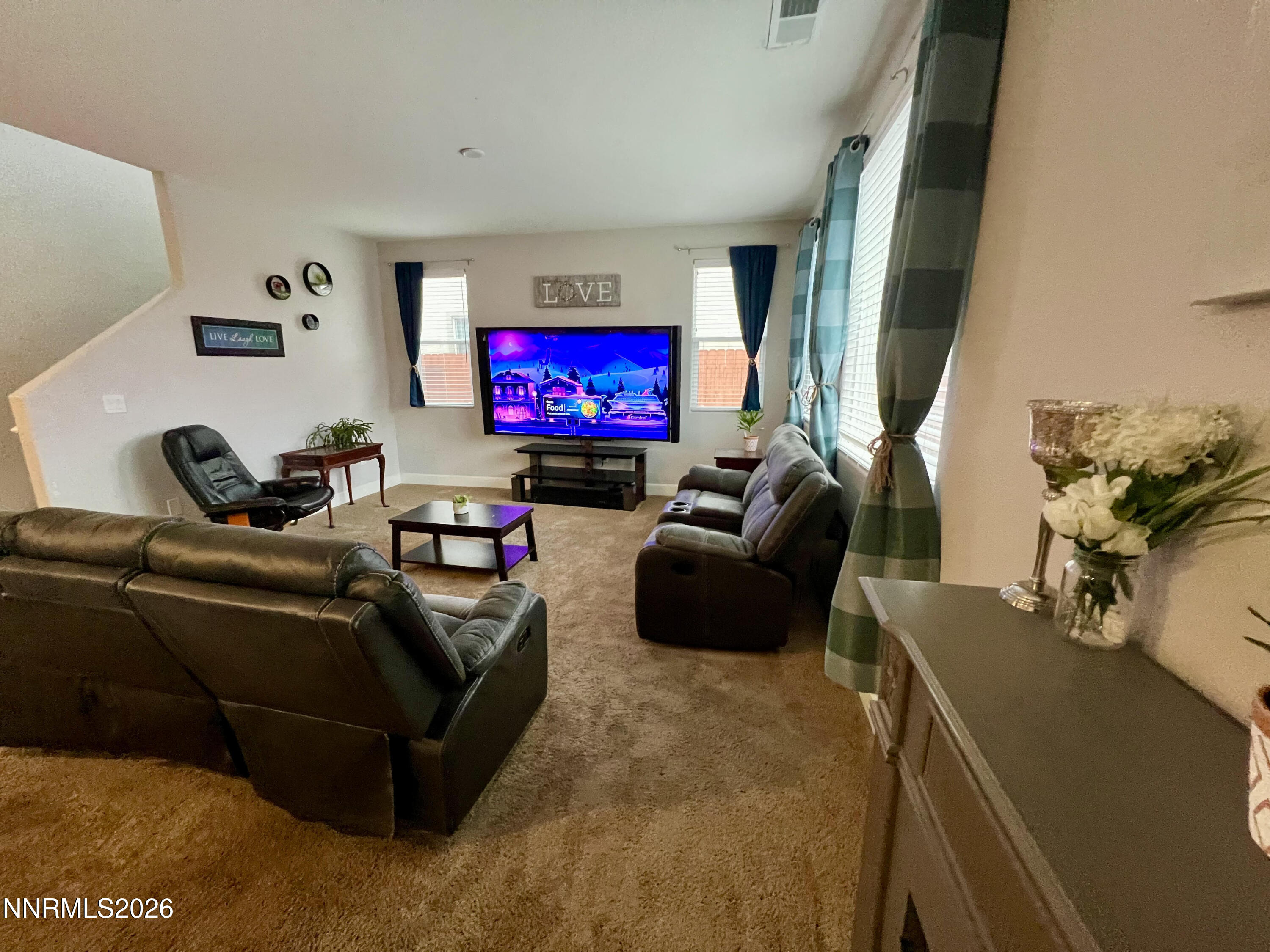 9355 Bay Drive Reno, NV 89506 - Photo 9 of 42 a living room with furniture and a flat screen tv