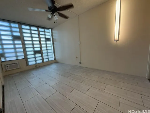 a view of an empty room with a window