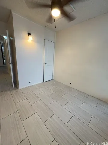a kitchen with a cabinets and white appliances
