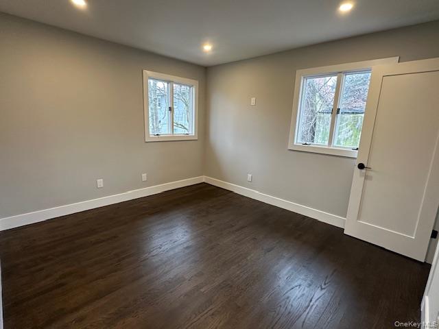 5 Linwood Road North, Unit 2 Port Washington, NY 11050 - Photo 11 of 12 Bedroom with dark wood-type flooring and recessed lighting