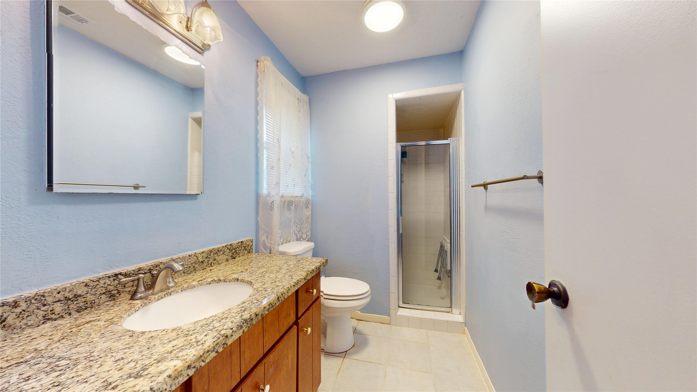 4715 Cypressdale Drive Spring, TX 77388 - Photo 23 of 45 Primary Bath with Walk-in Shower with an installed bath seat