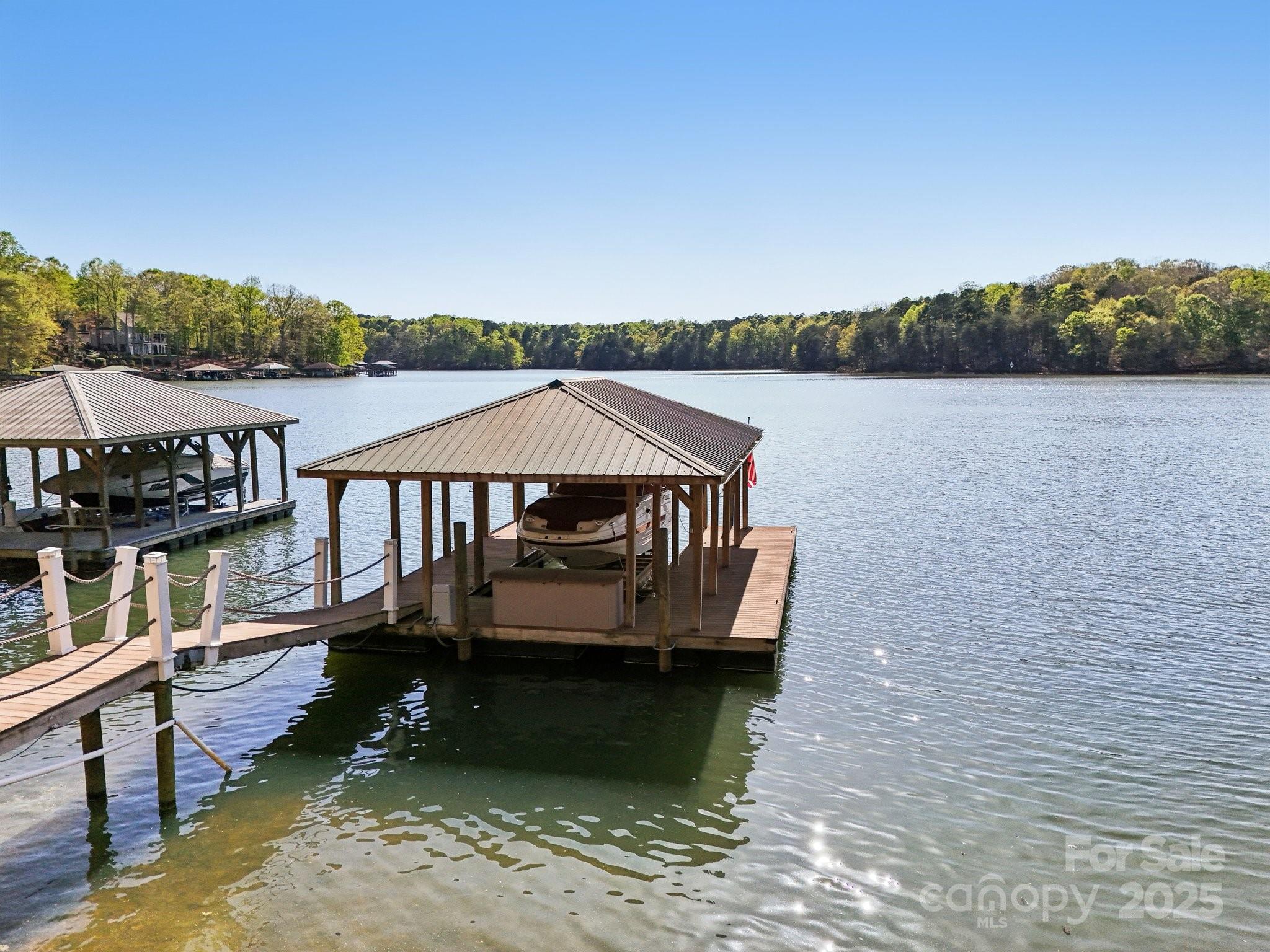 167 Maple View Drive Troutman, NC 28166 - Photo 2 of 48 a view of a lake with house next to a lake