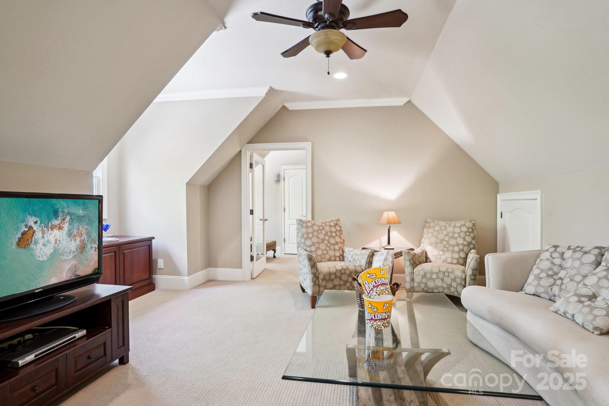 167 Maple View Drive Troutman, NC 28166 - Photo 22 of 48 a living room with furniture and a flat screen tv