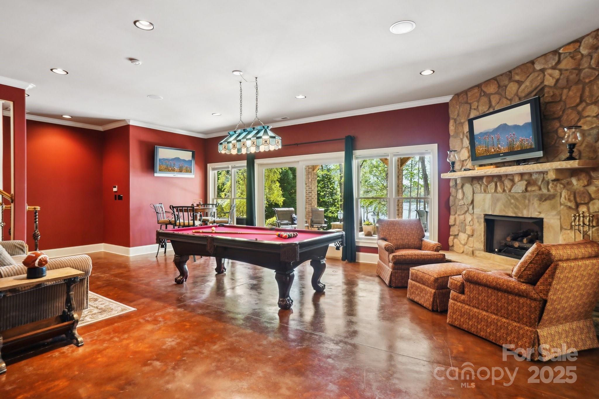 167 Maple View Drive Troutman, NC 28166 - Photo 25 of 48 a living room with furniture a large window and a fireplace