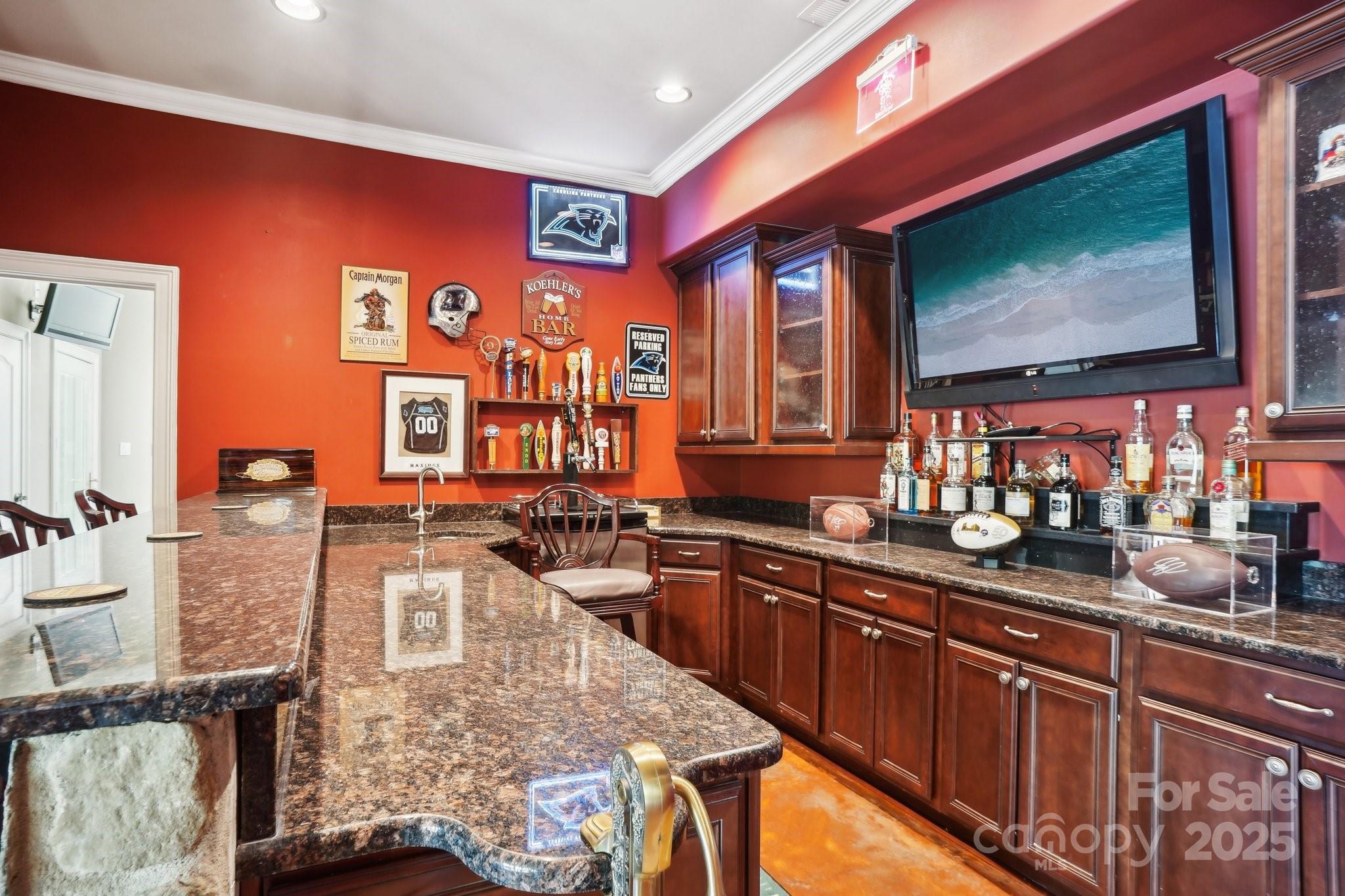 167 Maple View Drive Troutman, NC 28166 - Photo 27 of 48 a kitchen with stainless steel appliances granite countertop a sink stove and wooden cabinets