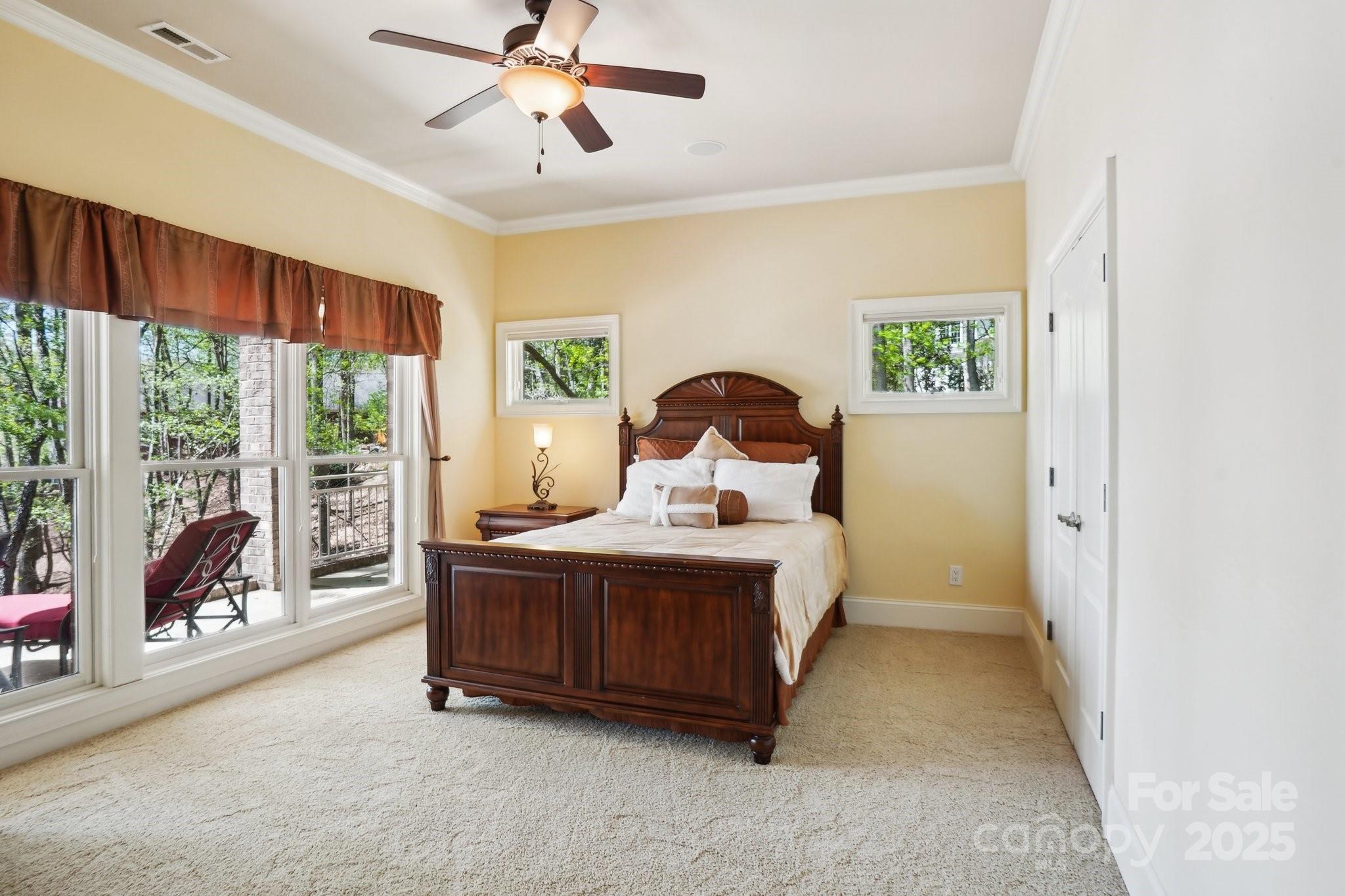 167 Maple View Drive Troutman, NC 28166 - Photo 28 of 48 a bed sitting in a spacious bedroom next to a window