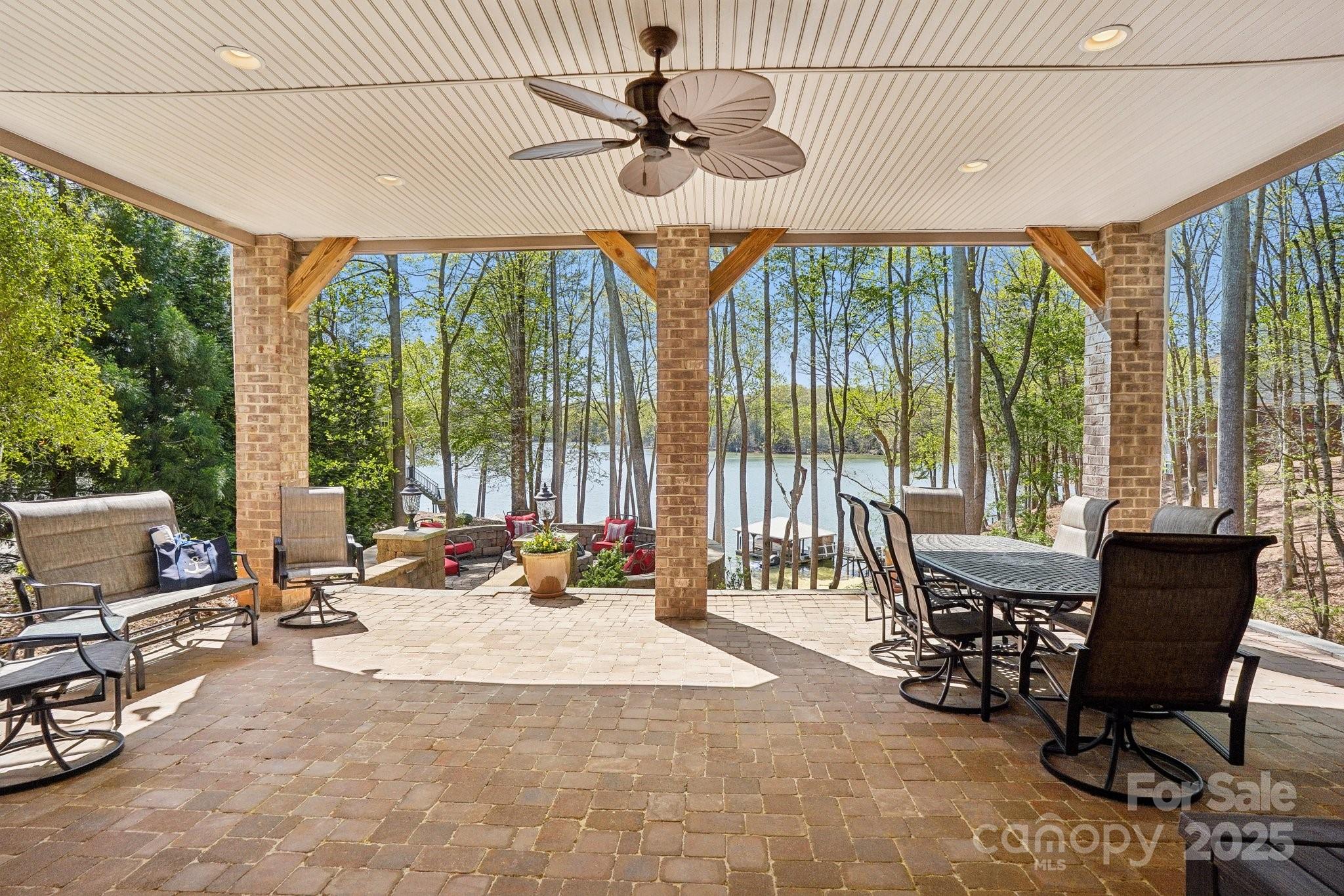 167 Maple View Drive Troutman, NC 28166 - Photo 33 of 48 a living room with furniture and floor to ceiling windows