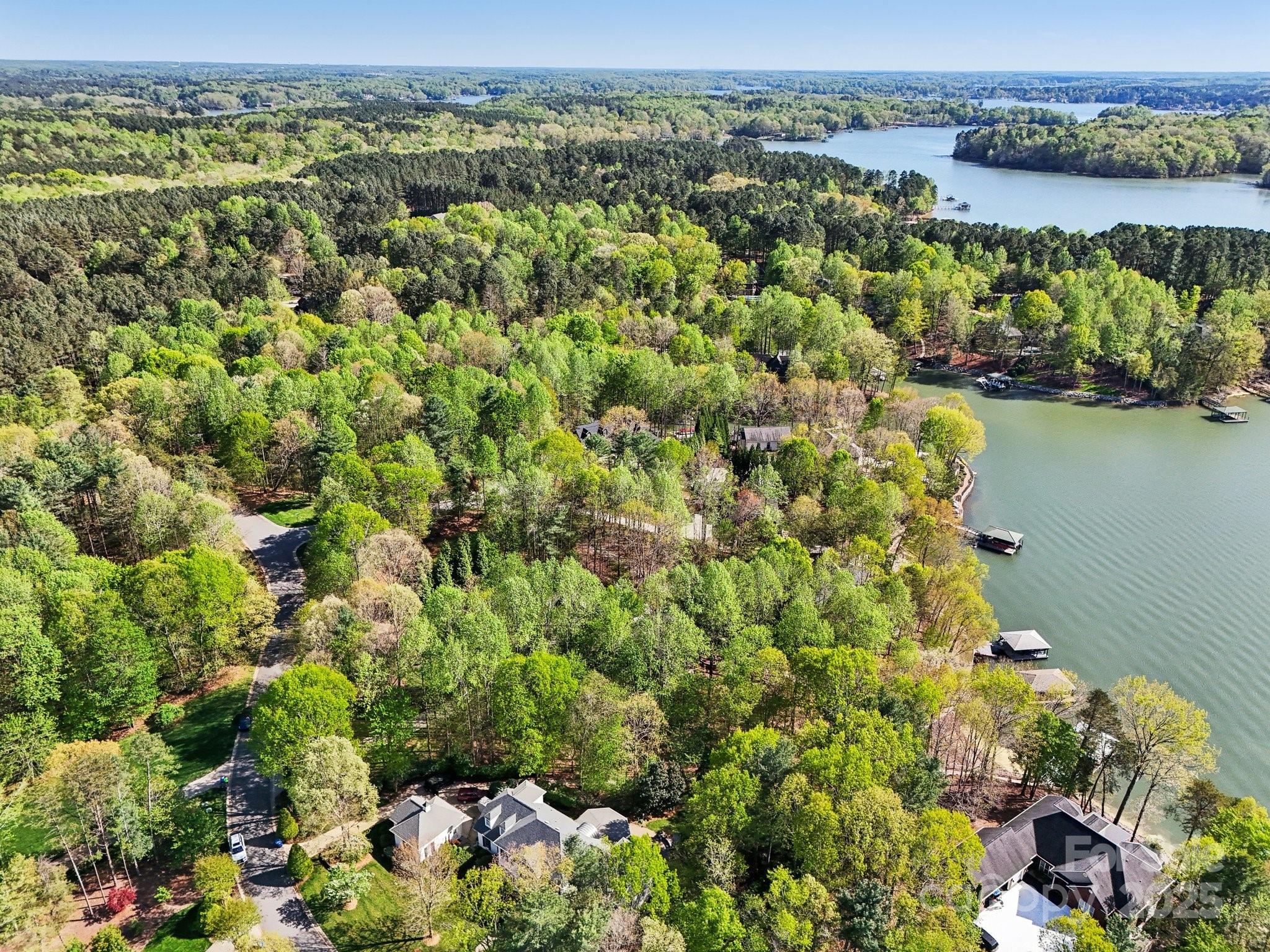 167 Maple View Drive Troutman, NC 28166 - Photo 41 of 48 a view of a lake with a city