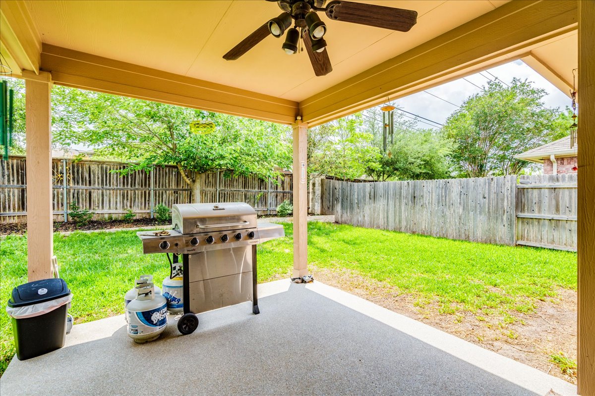 1151 Stone Rim Loop Buda, TX 78610 - Photo 26 of 36 Backyard covered patio