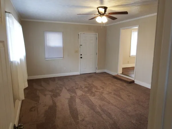 a view of an empty room with a window