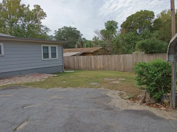 a view of backyard with green space