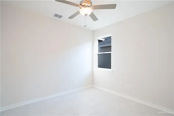 a bathroom with a granite countertop sink a toilet and a mirror