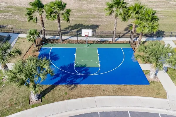 an aerial view of a swimming pool with a yard