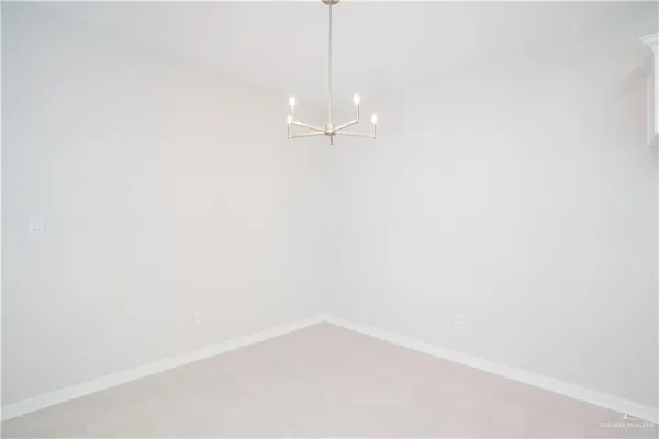 an empty room with a window and a ceiling fan