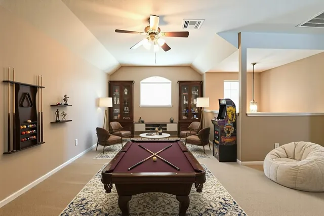 a room with furniture a rug and a chandelier