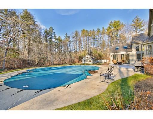 51 Townsend Farm Road Boxford, MA 01921 - Photo 4 of 30 a view of swimming pool outdoor seating and trees in the background