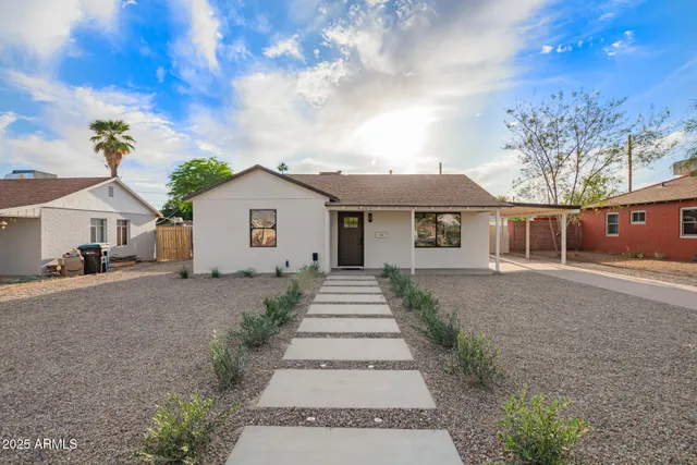 front view of a house with a yard