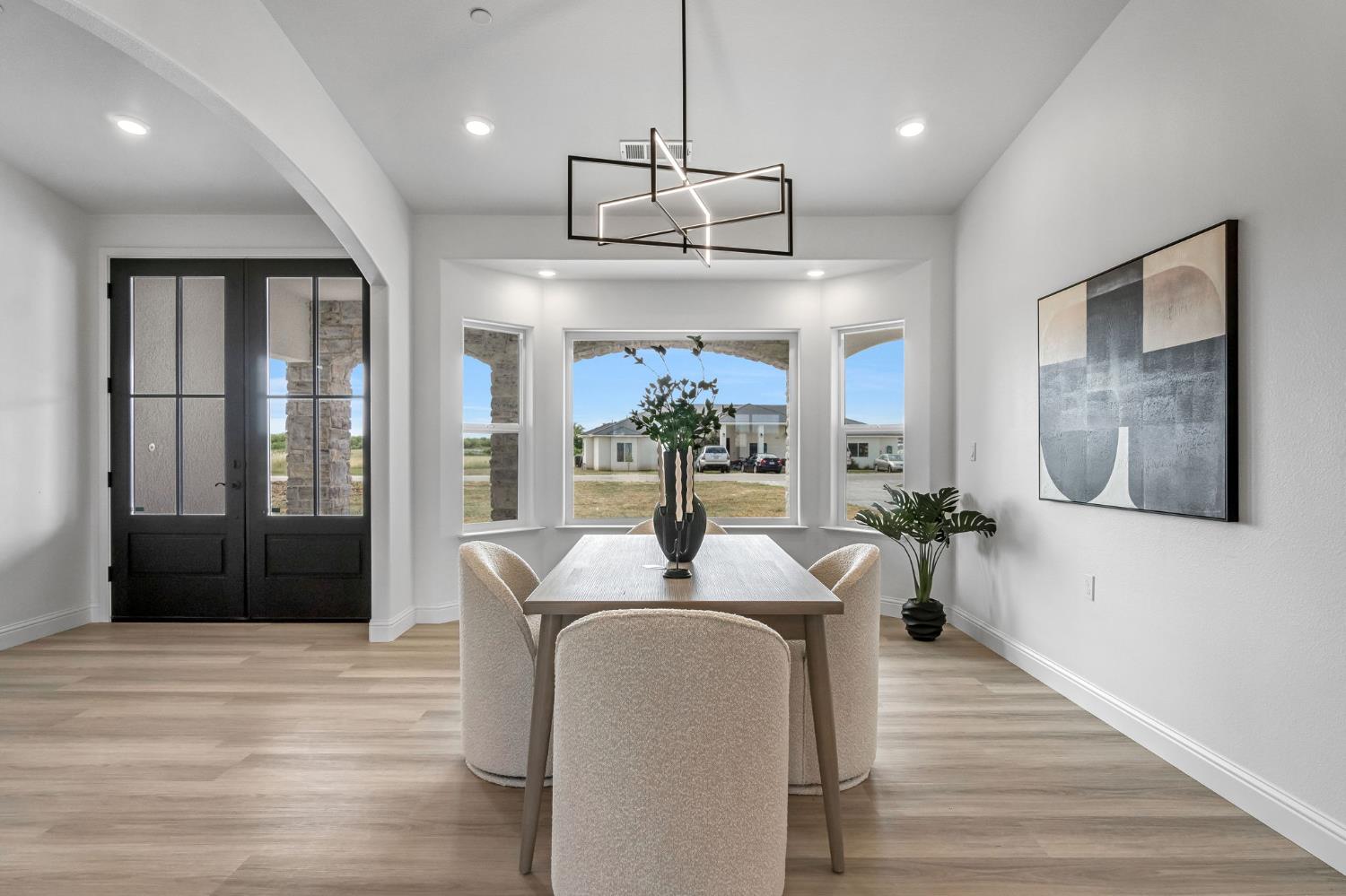 21035 Forest Glen Road Madera, CA 93638 - Photo 17 of 38 a view of a dining room with furniture wooden floor and chandelier