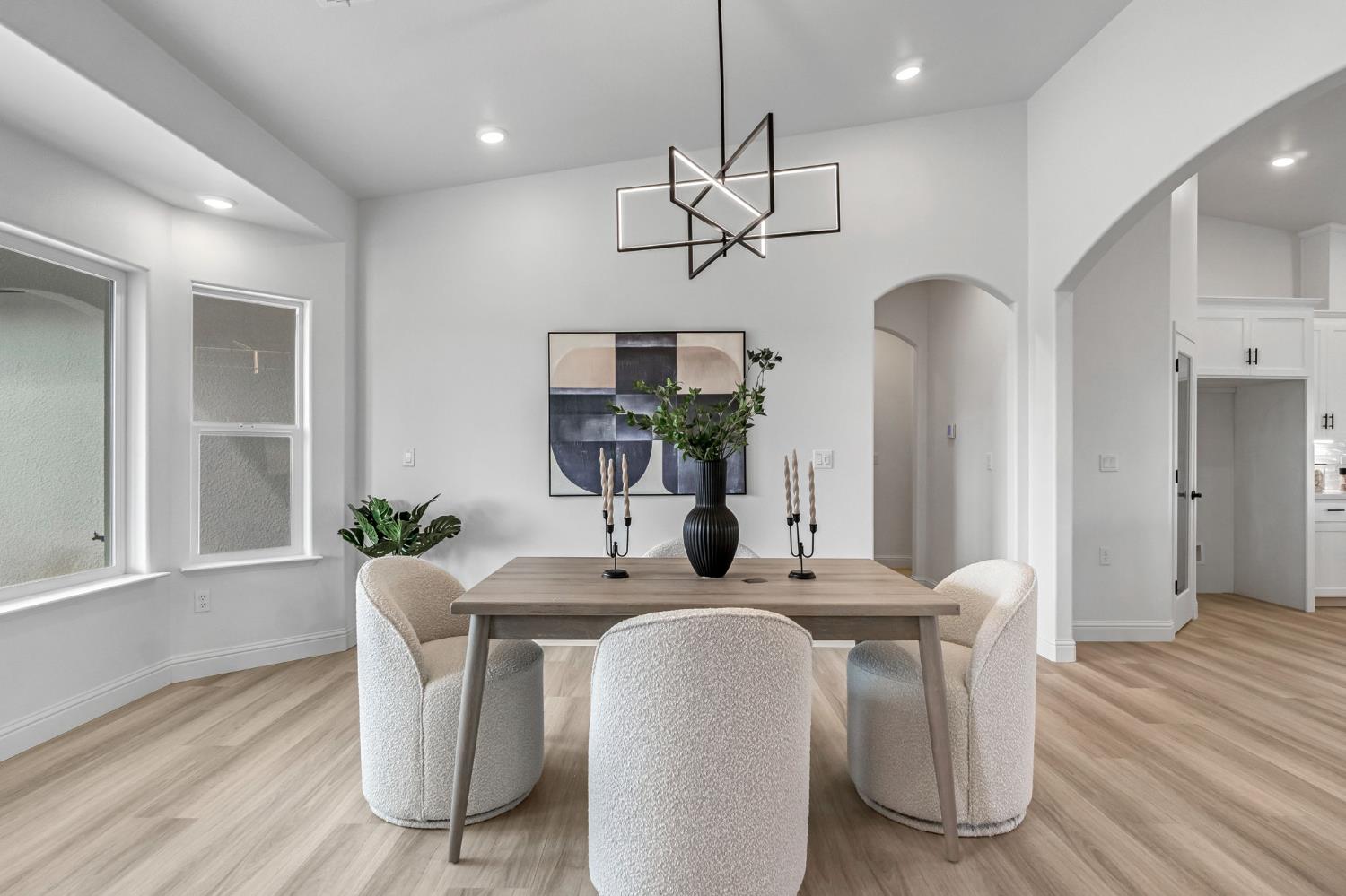 21035 Forest Glen Road Madera, CA 93638 - Photo 18 of 38 a dining room with furniture potted plants and wooden floor