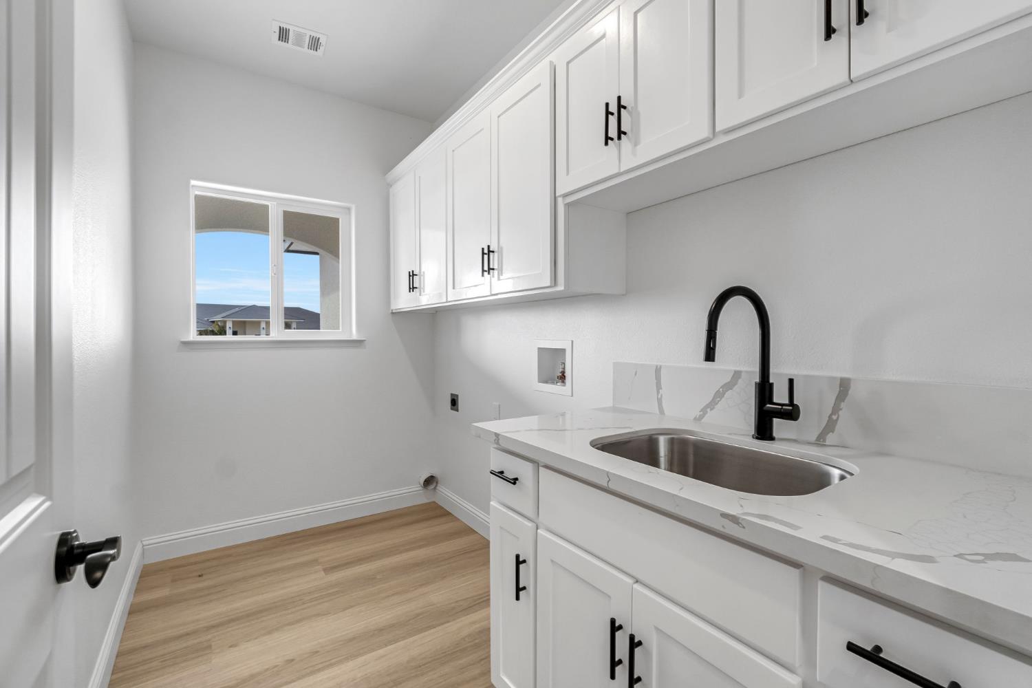 21035 Forest Glen Road Madera, CA 93638 - Photo 19 of 38 a kitchen with a sink and cabinets