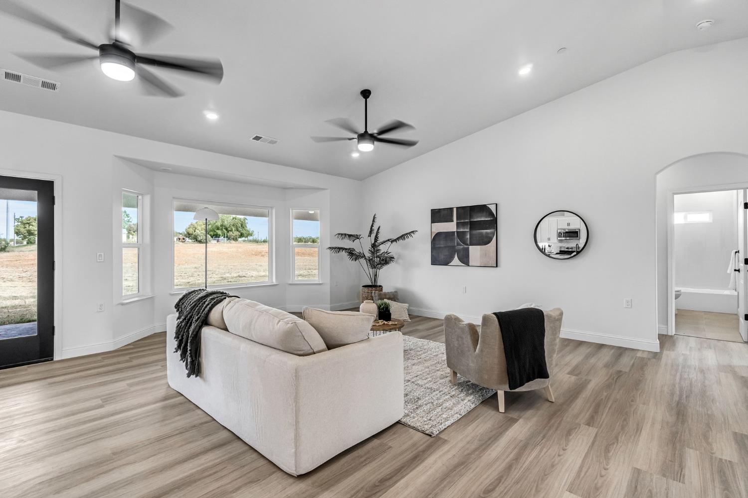 21035 Forest Glen Road Madera, CA 93638 - Photo 7 of 38 a living room with furniture and a wooden floor