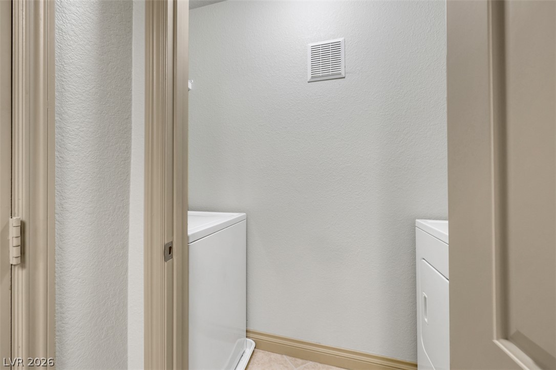 8101 West Flamingo Road, Unit 2136 Las Vegas, NV 89147 - Photo 17 of 32 An organized laundry closet provides dedicated space for essential appliances.
