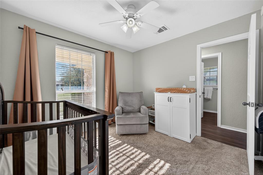 420 Robert Drive Springtown, TX 76082 - Photo 19 of 38 a living room with furniture and two windows