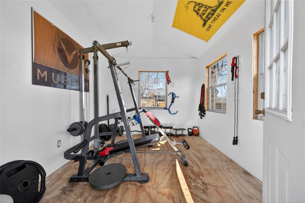 420 Robert Drive Springtown, TX 76082 - Photo 25 of 38 a view of a room with gym equipment