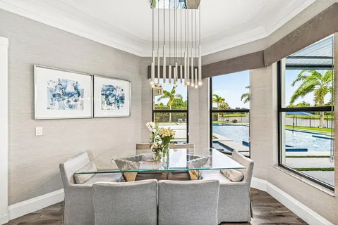 a bathroom with a granite countertop sink mirror vanity and toilet