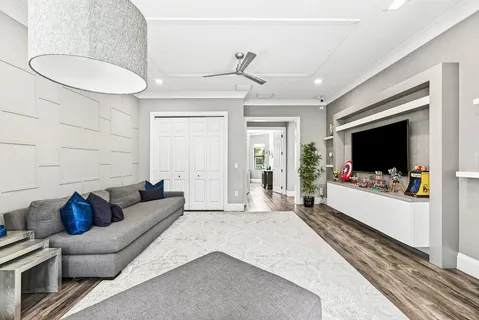 a view of a livingroom with furniture and windows