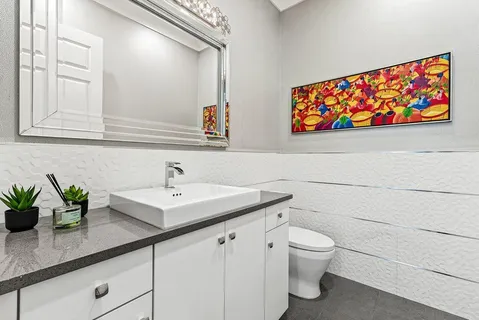 a bathroom with a sink toilet and shower