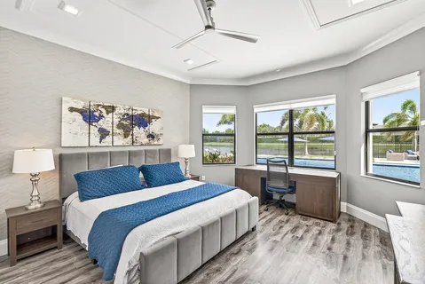 a large bedroom with a large bed and a large window