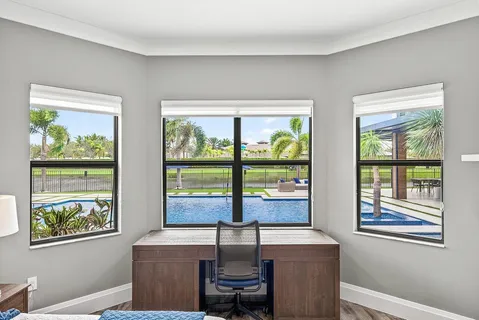 a bedroom with a large bed a flat tv screen and a closet